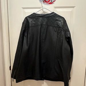 Leather 3/4 length coat with zipper closure. There are no rips or worn spots.